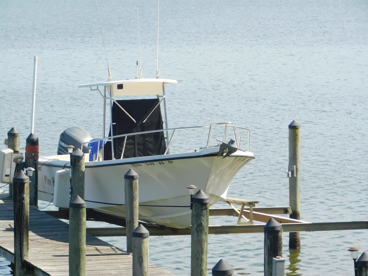 Boat moored at a wooden dock