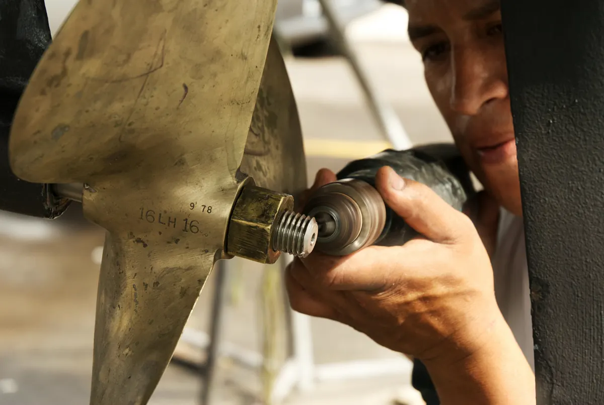 Boat propeller being serviced