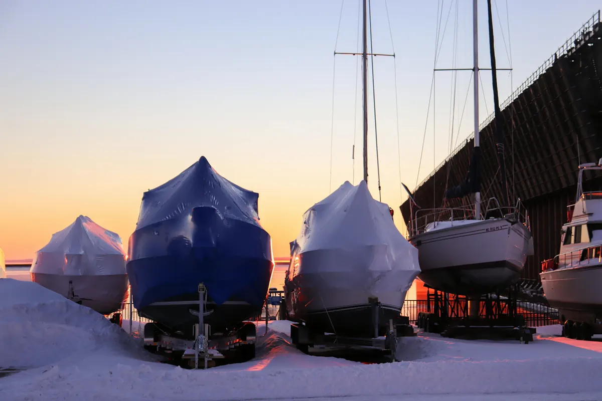 Shrink-wrapped boats stored for winter
