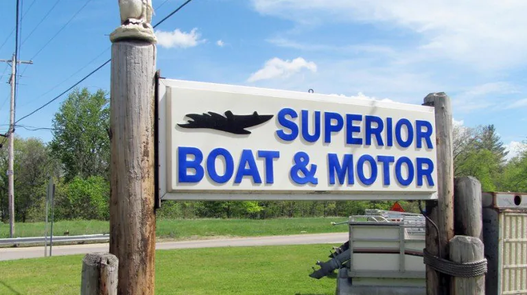 Superior Boat & Motor sign at the shop in Stanton, Michigan